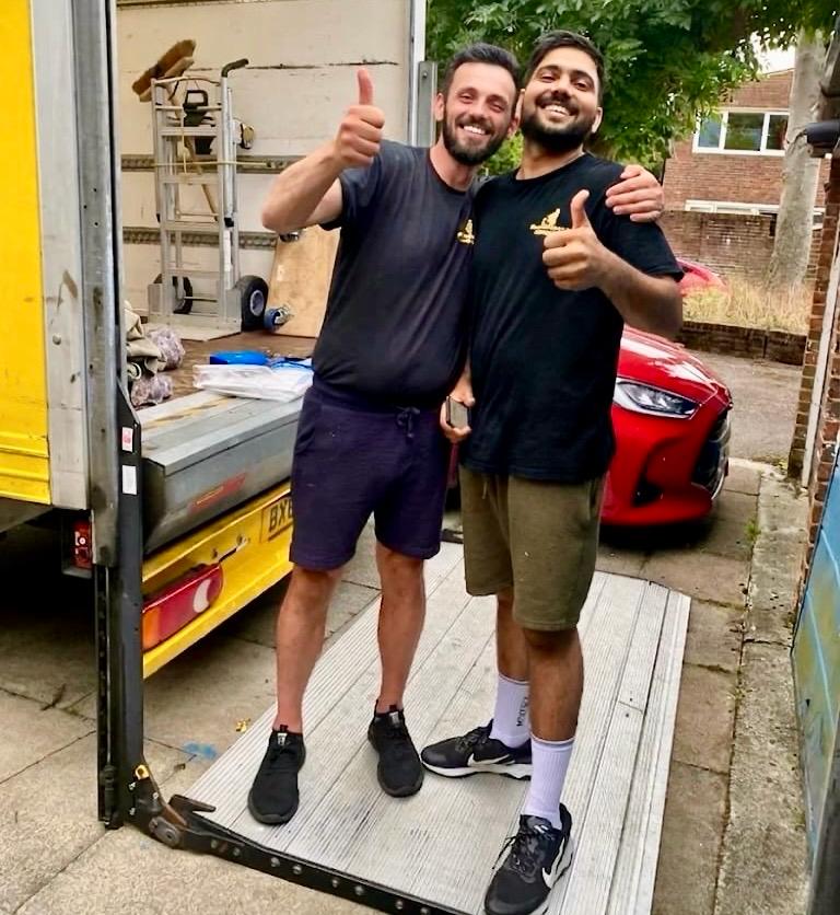 Two Yellow Van Company movers after a successful Morden removal &mdash; family-run team trusted across SM4 and South London since 2011
