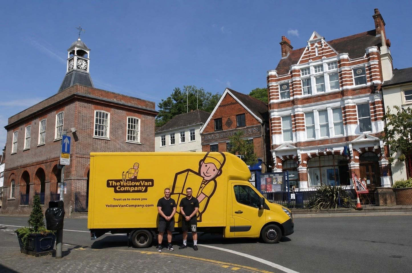 Yellow Van Company branded removal van on Reigate High Street &mdash; family-run Reigate removals firm serving RH2 and the surrounding Surrey area since 2011